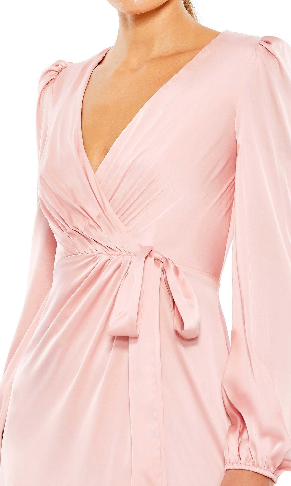 Someone wearing the Long Formal Dress 55624 by Mac Duggal—a rose pink, faux wrap style formal dress with a V-neckline, side tie detail, and long puff sleeves.